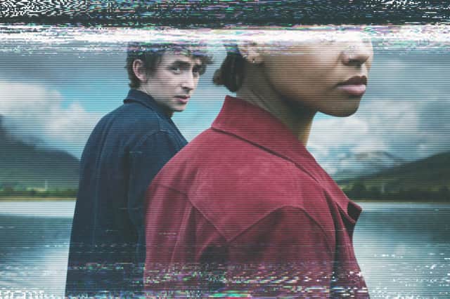 The poster for Black Mirror Season 6 episode 2 'Loch Henry'. It depicts Samuel Blenkin as Davis and Myha'la Herrold as Pia, obscured by a scratchy static video tape effect (Credit: Netflix)