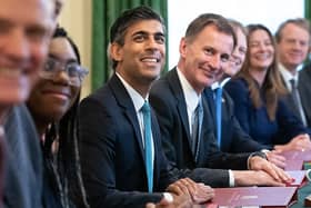 Rishi Sunak and Jeremy Hunt are considering awarding pay rises to certain groups of striking workers. (Photo by STEFAN ROUSSEAU/POOL/AFP via Getty Images)