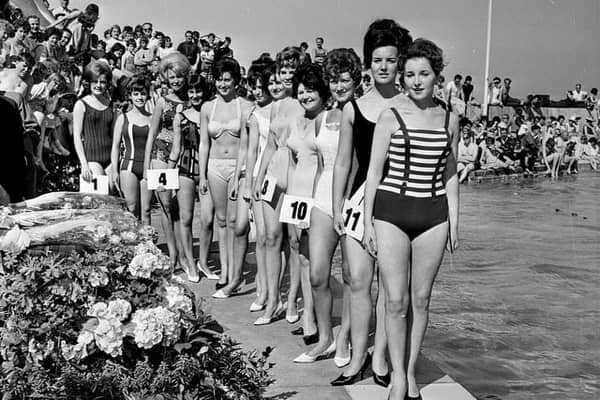 Contestants in the 1964 Miss Dunbar beauty pageant pose beside Dunbar Lido.