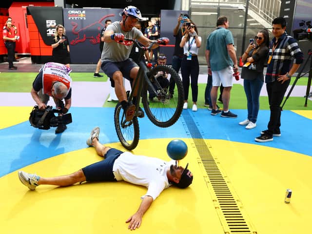 Sean Garnier and Kenny Belaey perform in the Paddock during final practice ahead of the 2023 F1 Grand Prix of Saudi Arabia. Image: Mark Thompson/Getty Images