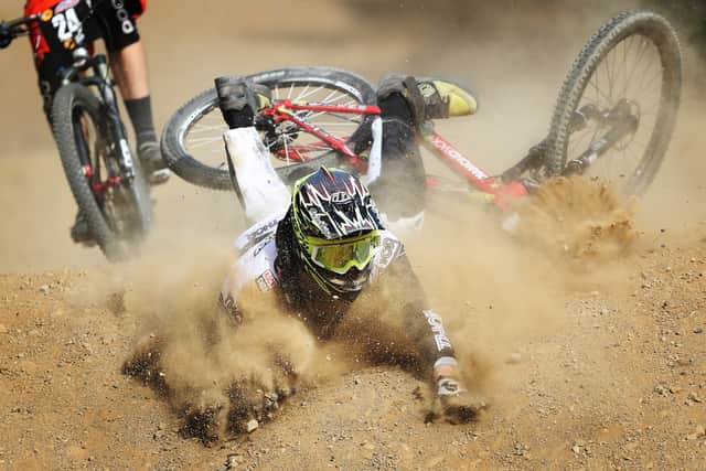 Crashes are common during the Mountain Biking Downhill. Jack Hudson of Great Britain crashed during the first round of the Four Cross at the 2016 UCI Mountain Bike World Cup in Fort William. Image: Ian MacNicol/Getty