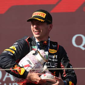 Max Verstappen holds the broken Hungarian Grand Prix trophy 
