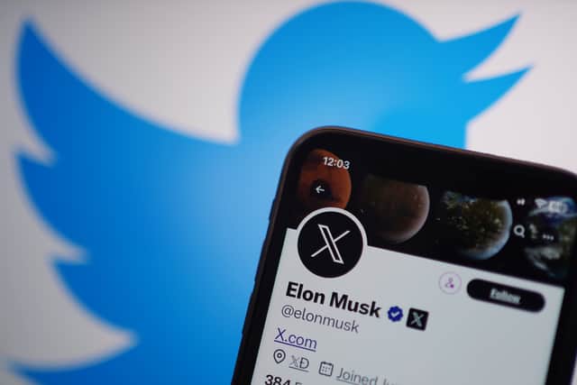 A phone displays the Twitter account for Elon Musk, showing the new logo for Twitter, and the website address X.com. Twitter has replaced the social media platform’s famous bird logo with an X as part of owner Elon Musk’s plans to create an “everything app”.