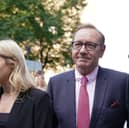 Actor Kevin Spacey walks through the media gathered outside Southwark Crown Court, London, where he is charged with three counts of indecent assault, seven counts of sexual assault, one count of causing a person to engage in sexual activity without consent and one count of causing a person to engage in penetrative sexual activity without consent between 2001 and 2005.