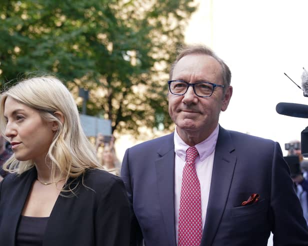 Actor Kevin Spacey walks through the media gathered outside Southwark Crown Court, London, where he is charged with three counts of indecent assault, seven counts of sexual assault, one count of causing a person to engage in sexual activity without consent and one count of causing a person to engage in penetrative sexual activity without consent between 2001 and 2005.