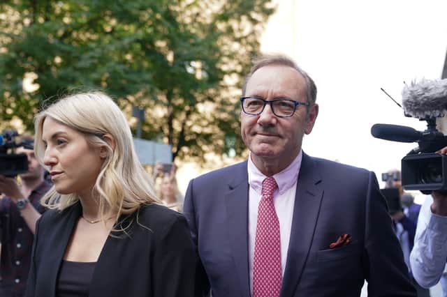 Actor Kevin Spacey walks through the media gathered outside Southwark Crown Court, London, where he is charged with three counts of indecent assault, seven counts of sexual assault, one count of causing a person to engage in sexual activity without consent and one count of causing a person to engage in penetrative sexual activity without consent between 2001 and 2005.
