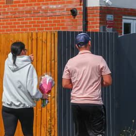 Members of the community lay flowers at the scene of the crash on Turnstone Road, Walsall.