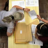 Pupils open their exam results. Credit: Matt Cardy/Getty Images