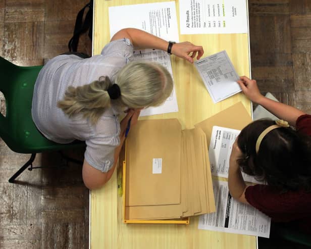 Pupils open their exam results. Credit: Matt Cardy/Getty Images