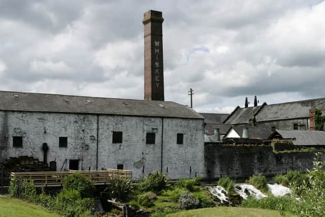 Pictured above is an Irish distillery. If you pay close attention to the chimney, you will see that  the beverage is listed as “whiskey” with the letter e included; there’s a historical reason for this. 