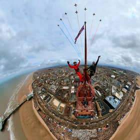 Two thrill-seekers have taken the ultimate selfie with the red arrows