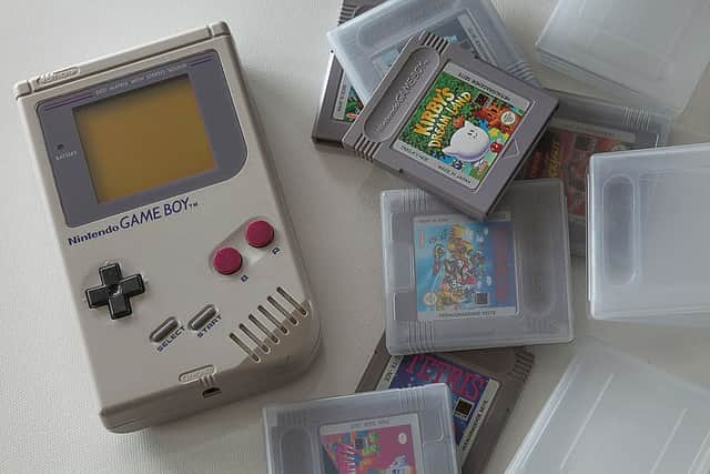 Super Mario Land (1989) cartridge next to the Nintendo Game Boy. 