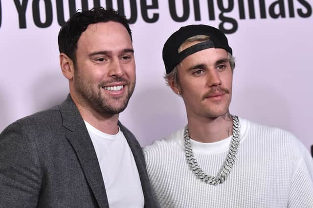 Several high profile artists including Justin Bieber (left) have reportedly left Scooter Braun's (right) management firm. Image: Lisa O'Connor/AFP