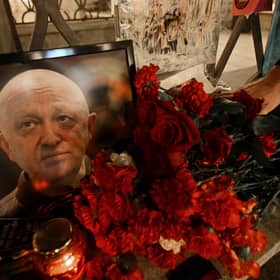  A man lays flowers at a makeshift memorial in honour of Yevgeny Prigozhin.