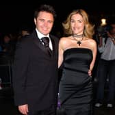 Actor Alex Ferns and his wife Jennifer arrive for at the 2002 National Television Awards.  Image: John Li/Getty Images     