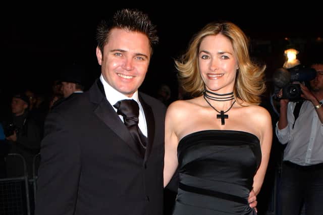 Actor Alex Ferns and his wife Jennifer arrive for at the 2002 National Television Awards. Image: John Li/Getty Images