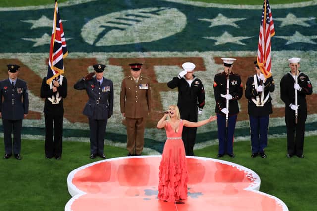 Cristina Kerslake performs God Save The Queen prior to the NFL International Series match at Wembley Stadium, London.