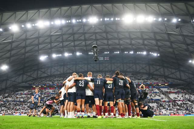 The players of England form a huddle at full-time following the Rugby World Cup France 2023 match between England and Argentina at Stade Velodrome in Marseille.
