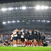 The players of England form a huddle at full-time following the Rugby World Cup France 2023 match between England and Argentina at Stade Velodrome in Marseille.