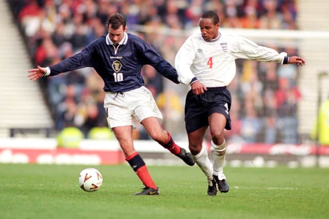 Don Hutchison battles with England’s Paul Ince at Hampden Park in 1999.