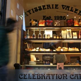 A pedestrian walks past a branch of a Patisserie Valerie cafe in London on January 23, 2019.