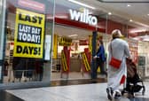  Shoppers walk past a Wilko store in Putney on September 12.