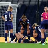 Lee Gibson (in pink) discusses tactics with her Scotland team mates against Belgium at Hampden Park last night (Photo by Ian MacNicol/Getty Images)