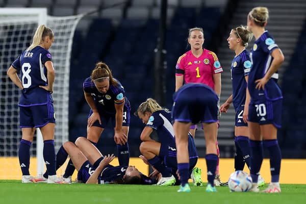 Lee Gibson (in pink) discusses tactics with her Scotland team mates against Belgium at Hampden Park last night (Photo by Ian MacNicol/Getty Images)