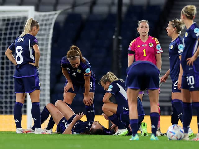 Lee Gibson (in pink) discusses tactics with her Scotland team mates against Belgium at Hampden Park last night (Photo by Ian MacNicol/Getty Images)