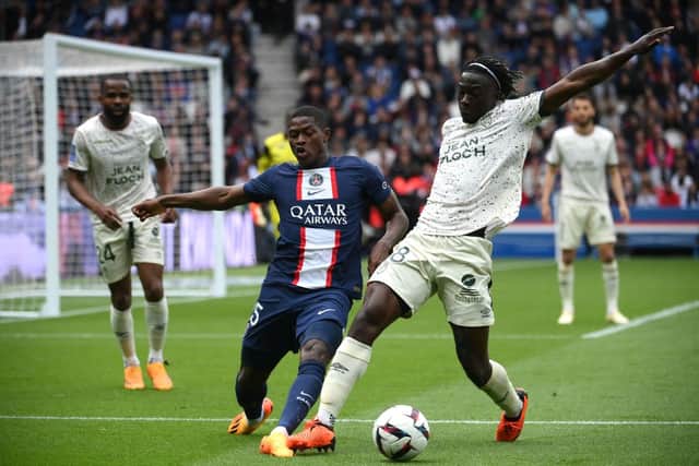 Bamo Meité battles with Paris Saint-Germain left-back Nuno Mendes. (Photo by FRANCK FIFE/AFP via Getty Images)