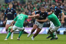 Pierre Schoeman of Scotland goes past Johnny Sexton during the Six Nations Rugby match between Scotland and Ireland at Murrayfield Stadium on March 12, 2023 - the last time the two teams played each other before the Rugby World Cup.