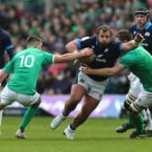 Pierre Schoeman of Scotland goes past Johnny Sexton during the Six Nations Rugby match between Scotland and Ireland at Murrayfield Stadium on March 12, 2023 - the last time the two teams played each other before the Rugby World Cup.