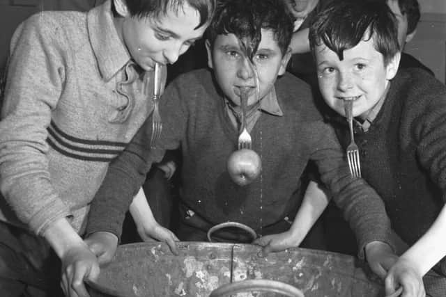 “The Tweedie Memorial Boy’s Club Hallowe’en party showing boys dookin’ for apples in 1967.” 