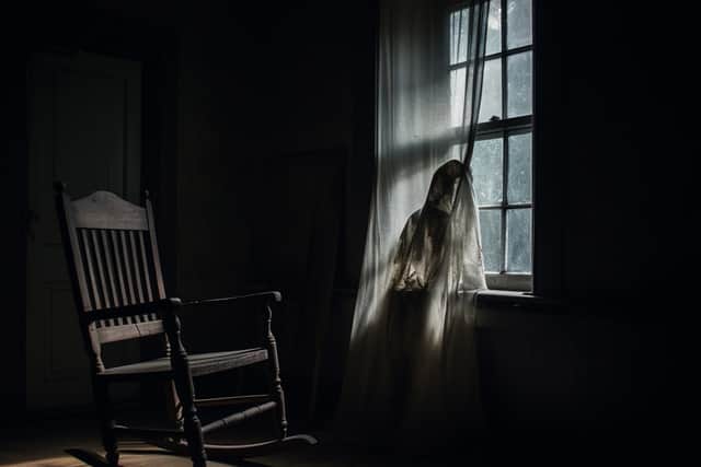 Ghost in abandoned, haunted attic. Image: Adobe