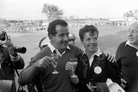“Europe's Sam Torrance toasts victory with his wife Elizabeth after holing the winning putt.” (1985) 