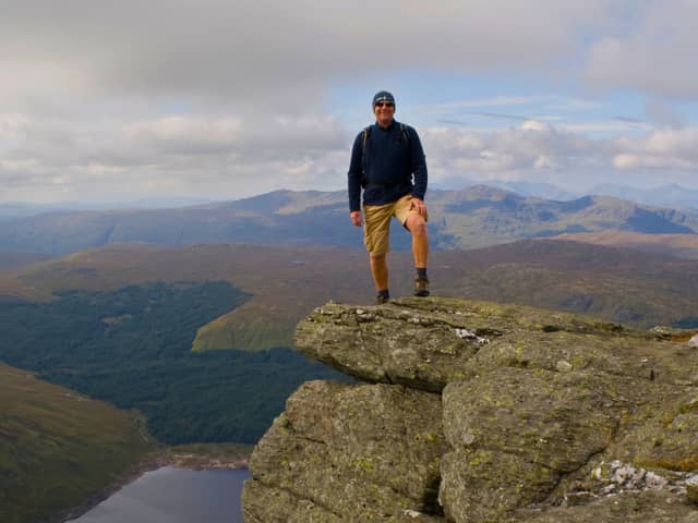 “Man standing on top of Ben Vorlich in Loch Lomond and The Trossachs National Park.” (jgshields)