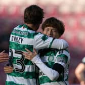 Matt O'Riley and Kyogo Furuhashi celebrate during Celtic's win at Tynecastle.