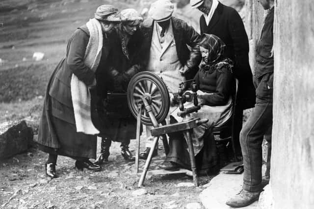 “The brave Islanders of storm-swept St. Kilda, Britain's loneliest outpost, as a woman demonstrating to visitors the art of spinning.” (September 28, 1926) 