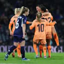 Netherlands celebrate their winning goal against Scotland at Hampden Park last night. Cr. Getty Images