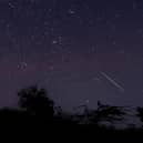 A meteor streaking through the night sky over Myanmar during the Geminid meteor shower (Photo: YE AUNG THU/AFP via Getty Images)