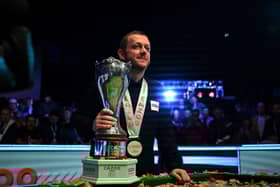 Northern Ireland's Mark Allen poses with the winner's trophy after the snooker final of the 2022 Cazoo UK Championship at the York Barbican in York.