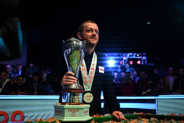 Northern Ireland's Mark Allen poses with the winner's trophy after the snooker final of the 2022 Cazoo UK Championship at the York Barbican in York.