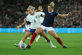 Sophie Howard tackles Rachel Daly during the side's clash back in September. Cr. Getty Images.