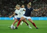 Sophie Howard tackles Rachel Daly during the side's clash back in September. Cr. Getty Images.