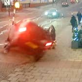 CCTV capturing the dramatic moment a mum managed to pull her two-year-old daughter to safety seconds before her pram was crushed underneath a car in a heart-stopping crash (SWNS)