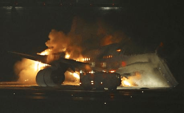 A Japan Airlines plane is on fire on the runway of Tokyo’s Haneda airport on Tuesday, Jan. 2, 2024 in Tokyo, Japan. (Kyodo News via AP)