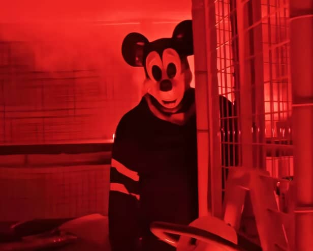 Mickey Mouse has been turned into a sadistic serial killer after his copyright laws ended. Cr. Into Frame Productions.