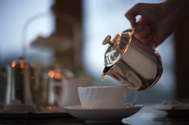 Tea being poured into a teapot. Picture: Getty Images