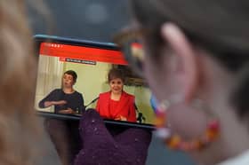 Members of the public gathered outside Bute House in Edinburgh to watch the press conference where First Minister Nicola Sturgeon announced she would stand down as First Minister for Scotland after eight years.