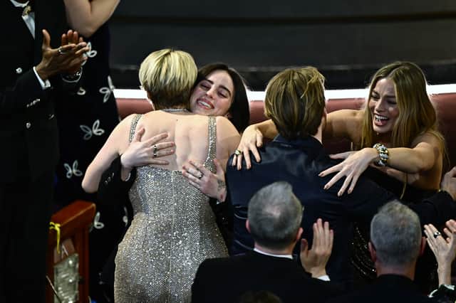 Barbie director Greta Gerwig and Margot Robbie hug Billie Eilish and Finneas O'Connell after they won the award for Best Original Song for "What Was I Made For" from "Barbie" during the 96th Annual Academy Awards. Image: Getty
